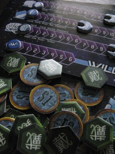 Skill track and game tokens from the game Firefly: Out to the Black